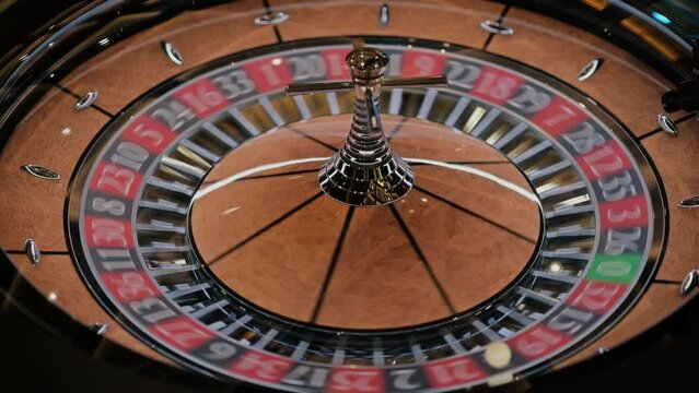 Roulette wheel at the Casino. Gambling. Close up of roulette wheel in motion. Lucky game.