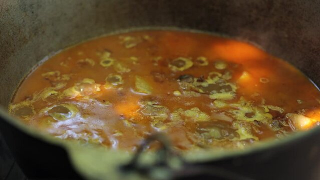 Cooking. summer vacation near the barbecue. Summer picnic, bonfire. Hot soup in a pot. Bograch in Transcarpathia, a Ukrainian dish.