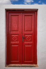 Wooden Red Wooden Door Entrance to a Traditional House In Megalochori Village - Santorini Island, Greece - Travel Destination, Summer