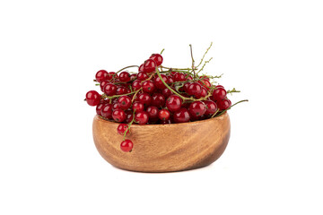 Ripe juicy red currants in a wooden bowl on a white background.