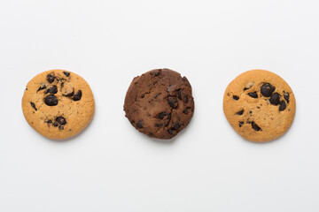 Flat lay with chocolate chip cookies on white background