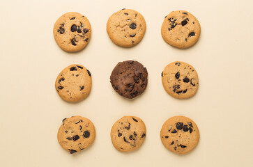 Flat lay with chocolate chip cookies on color background
