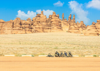 Bicycles and desert cliffs formations landscape at Hegra, Al Ula, Saudi Arabia