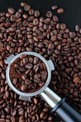 Ground coffee beans in a holder for a coffee machine