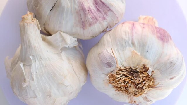 garlic, rotation in circle. Fresh garlic bulbs Turning. selective focus.