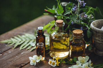 Assortment of organic essential oils, herbal extracts and medical flowers herbs In glass bottles....