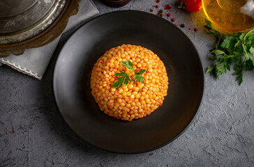 Couscous pilaf with tomatoes. Turkish name; domatesli kuskus pilavi