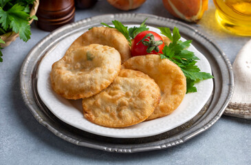 Delicious meat pie from Turkish cuisine. Fried handmade pies. Turkish name; fincan boregi or puf borek