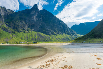 The crystal clear water of the Ersfjordstranda beach in Senja Island,  Norway