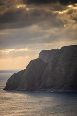 Beautiful sun beams over the North Cape cliff and the Arctic Ocean,  Norway