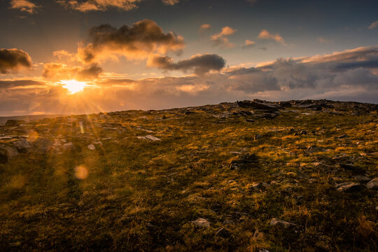 Midnight sun rising over Knivskjellodden, a trail in the tundra towards the true northernmost point of Europe,  Norway