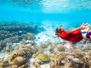Child snorkeling. Kids underwater. Beach and sea.