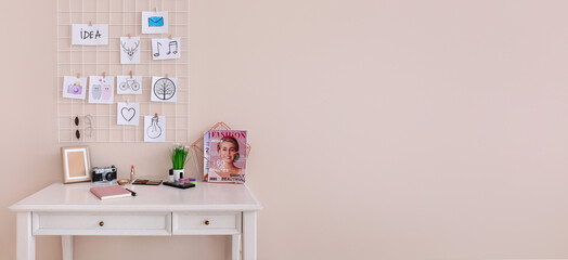 Comfortable workplace with mood board and makeup cosmetics in room. Banner for design