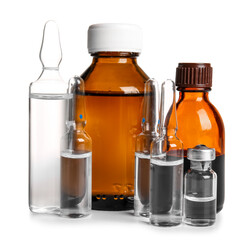 Medical ampules with bottles on white background
