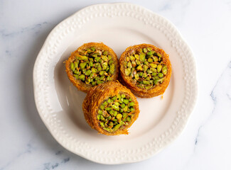 Traditional Turkish desserts; Kadaif stuffed with pistachios. Turkish name; Kadayif dolmasi or dolma kadayif. Halep sarma, halep sarmasi.