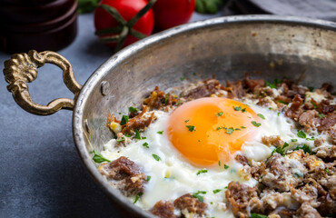 From traditional Turkish cuisine; fried eggs with meat. Turkish name; kavurmali yumurta