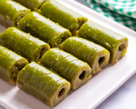 Pistachio baklava. Traditional Middle Eastern Flavors. The local name of Baklava is Fıstıklı Baklava or fıstıklı dolama. Turkish style pistachio baklava presentation and service