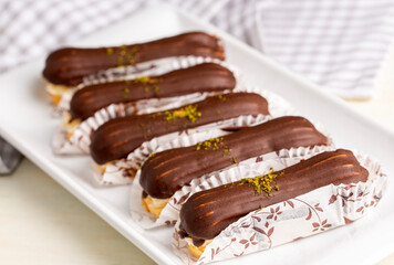Traditional french eclairs with chocolate.