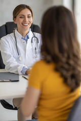 Young woman visiting doctor in clinic - 622463128