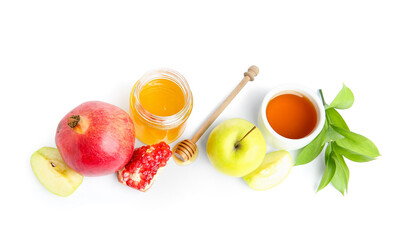 Composition with fresh fruits, honey and plant branch on white background. Rosh hashanah (Jewish New Year) celebration