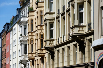 beautifully restored grunderzeit facades with bay windows in cologne's belgian quarter