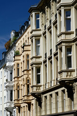 beautifully restored grunderzeit facades with bay windows in cologne's belgian quarter