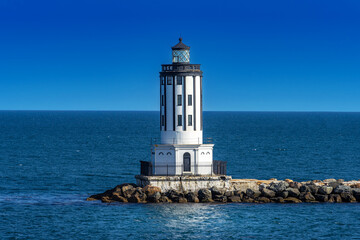 Historic black and white lighthouse a the breakwater at the Port of Los Angeles, California