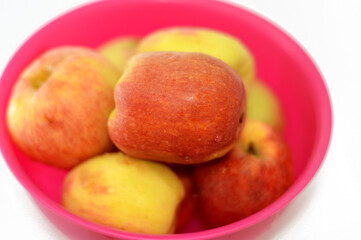 Bowl full of Egyptian fresh Apples, An apple is a round, edible fruit produced by an apple tree...