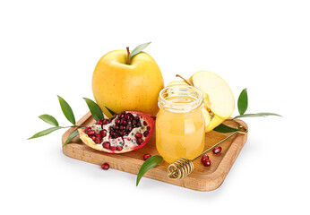 Wooden board with ripe apples, pomegranate, sweet honey and plant leaves on white background. Rosh hashanah (Jewish New Year) celebration