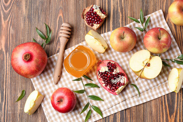 Composition with ripe fruits and honey on wooden background. Rosh hashanah (Jewish New Year) celebration
