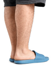 Male legs in flip-flops on white background