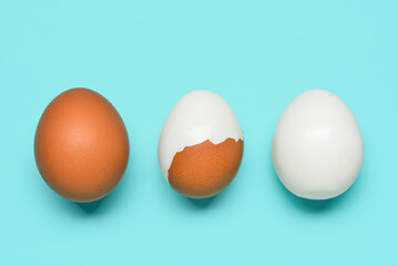 Tasty boiled eggs on blue background