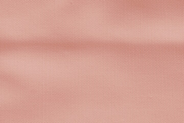 Canvas fabric texture abstract background in pale pink color.
