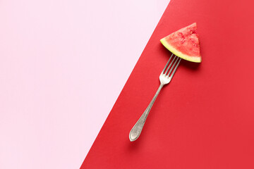 Fork with piece of fresh watermelon on colorful background
