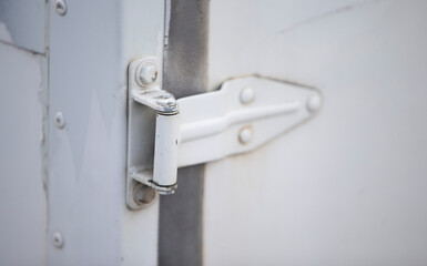 Old white door handle on a white background. Close-up.