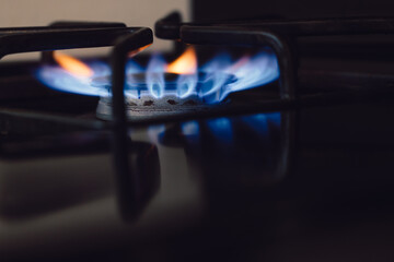 close up of the blue flames on a gas burning range or stove