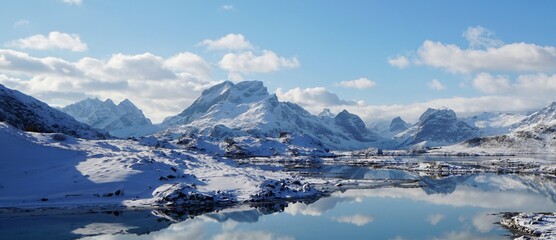 Fototapeta na wymiar Snow mountain with lake in winter season of Norway, Europe. 