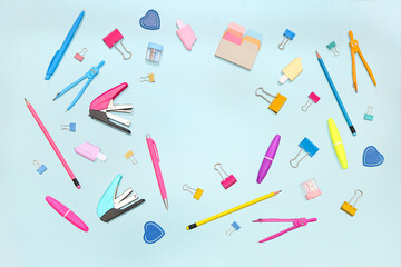 Frame made of stationery on blue background