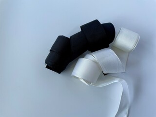 close up of white and black ribbons 