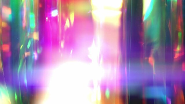 Sparkle and shine Christmas background. Reflection of Light, glare on the lens, light overlay. Purple pink magenta blue color gradient
