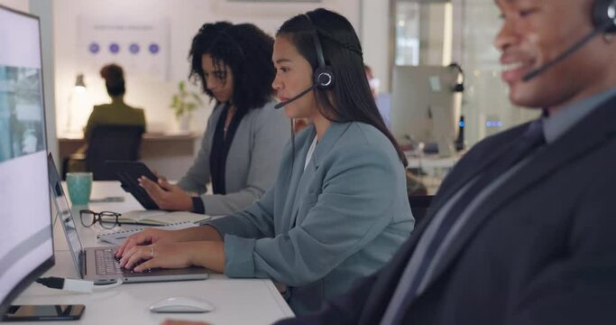 Call center, team and typing on computer with a headset for customer service, advice or chat. Women and man consultant coworking for telemarketing, technical support or crm help desk and working late