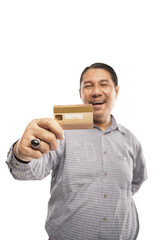 old asian man wearing shirt and ring holding his credit card and showing it happily in white...