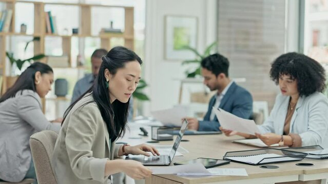 Business woman, meeting and lawyer notes for data analysis in a office. Conference room, Asian female person and professional reading a law review and attorney report with staff for a project