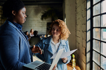 Young man and woman working together in a startup office