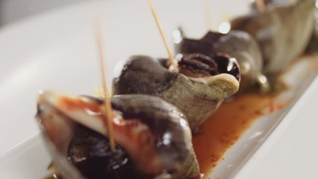 Gourmet Snails close shot, exotic dish of the sea... Caracoles
