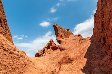 Obraz premium Blue sky over red sandy canyons. Amazing geological landscape.