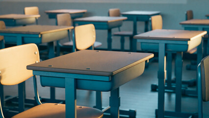 Fototapeta na wymiar Empty school classroom desks and chairs, 3d rendering