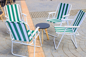 Summer terrace of the restaurant. Table and chairIs outside the cafe.