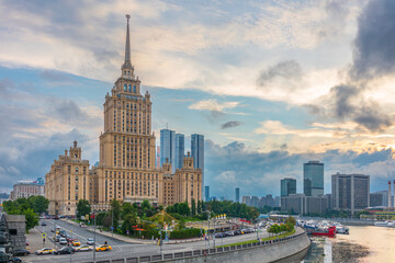 High-rise stalinist building near river at summer sunset in Moscow, Russia. Historic name is Hotel Ukraine.
