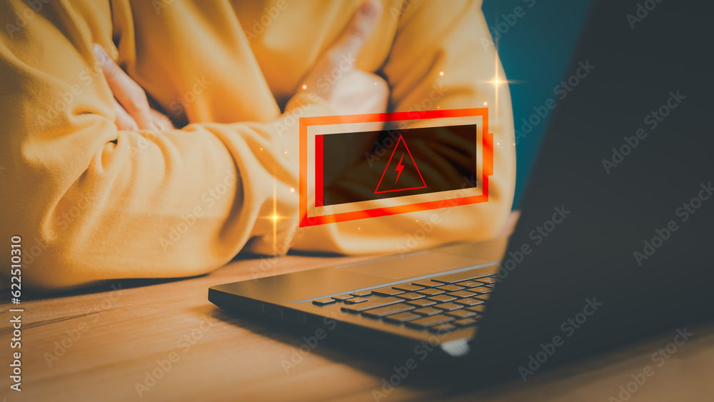 Poster User is angry and frustrated when he learns that his the laptop computer's battery is dead and did not bring the charger adapter. Concept of Technology and daily life of freelance. No power battery.